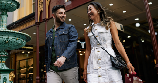 Two people walk outside the Adelaide Arcade