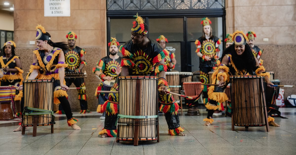 An arts group performing in a public place